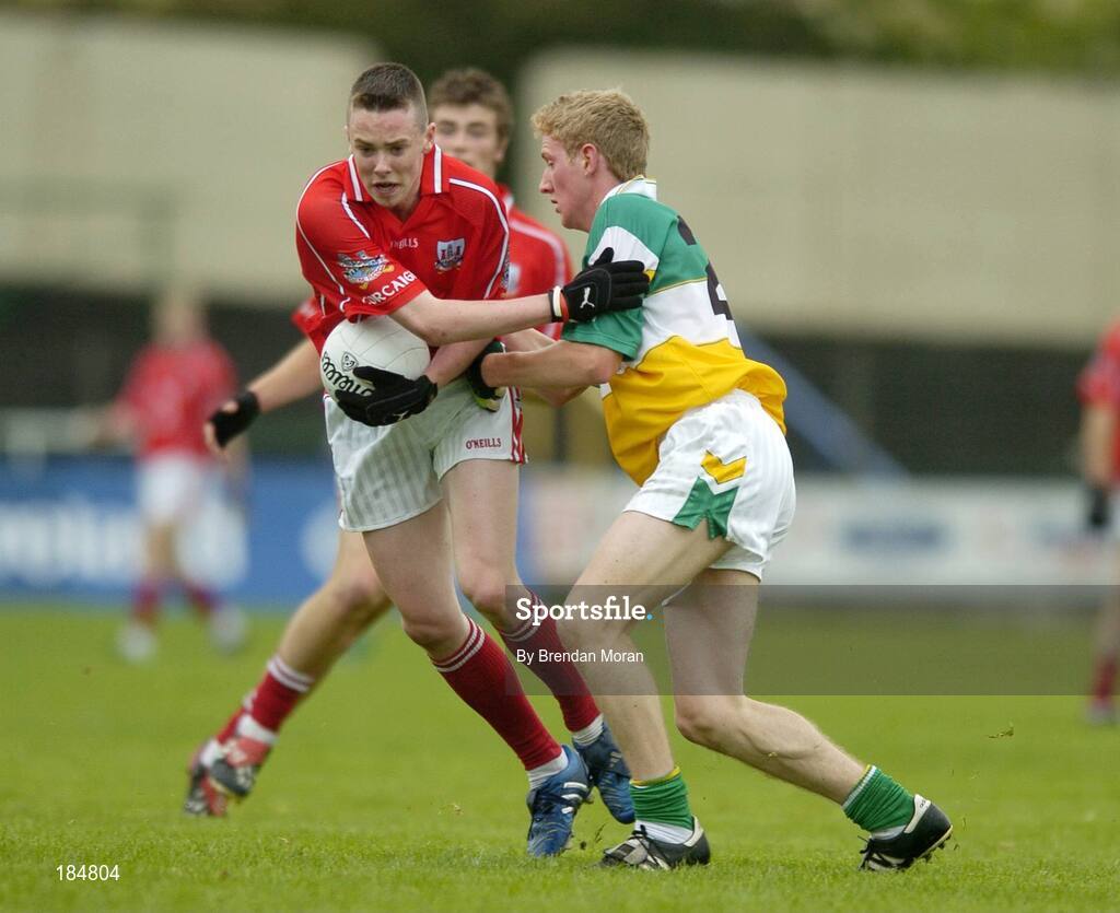 30 July 2005; Sean Kiely, Cork is tackled by Stephen Lonergan, Offaly. All-Ireland Minor Football Championship Quarter Final, Cork v Offaly, O'Moore Park, Portlaoise, Co. Laois. Picture credit; Brendan Moran / SPORTSFILE