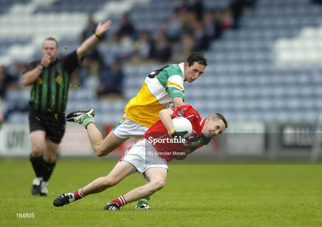 30 July 2005; David Kearney, Cork is tackled by James Guinan, Offaly. All-Ireland Minor Football Championship Quarter Final, Cork v Offaly, O'Moore Park, Portlaoise, Co. Laois. Picture credit; Brendan Moran / SPORTSFILE