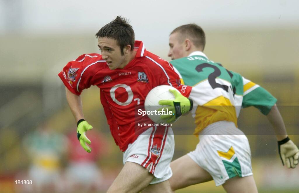 30 July 2005; Rickey Kenny, Cork is tackled by Gerry Treacy, Offaly. All-Ireland Minor Football Championship Quarter Final, Cork v Offaly, O'Moore Park, Portlaoise, Co. Laois. Picture credit; Brendan Moran / SPORTSFILE