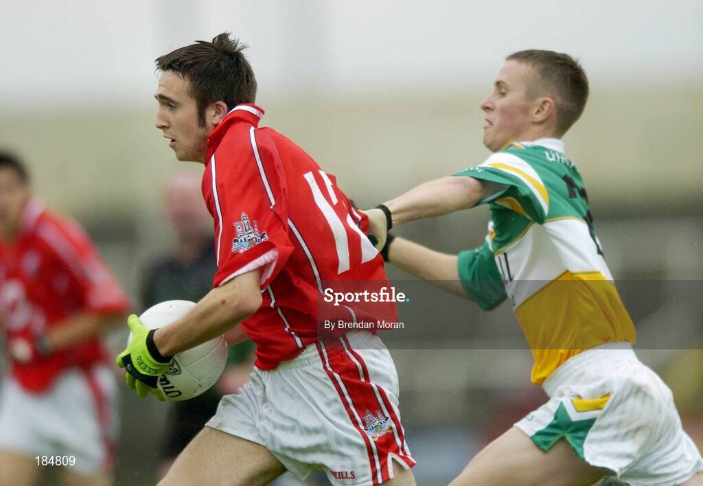 30 July 2005; Rickey Kenny, Cork is tackled by Gerry Treacy, Offaly. All-Ireland Minor Football Championship Quarter Final, Cork v Offaly, O'Moore Park, Portlaoise, Co. Laois. Picture credit; Brendan Moran / SPORTSFILE