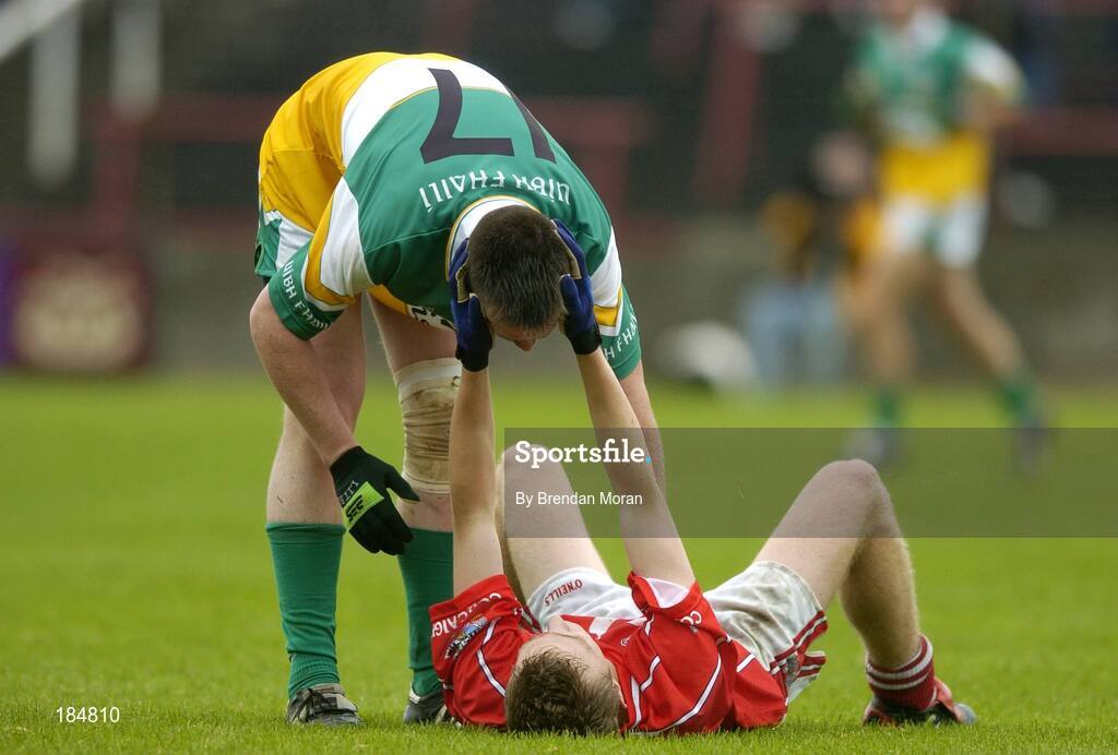 30 July 2005; Alan Barry, Cork is consoled by Ross Brady, Offaly, after the final whistle. All-Ireland Minor Football Championship Quarter Final, Cork v Offaly, O'Moore Park, Portlaoise, Co. Laois. Picture credit; Brendan Moran / SPORTSFILE