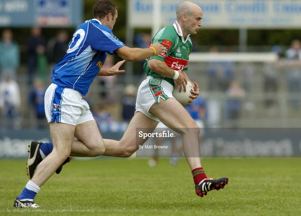 30 July 2005; Shane Fitzmaurice, Mayo, is tackled by Paddy Brady, Cavan. Bank of Ireland Football Championship qualifer, Round 4. Mayo v Cavan, Dr. Hyde Park, Roscommon. Picture credit; Matt Browne / SPORTSFILE