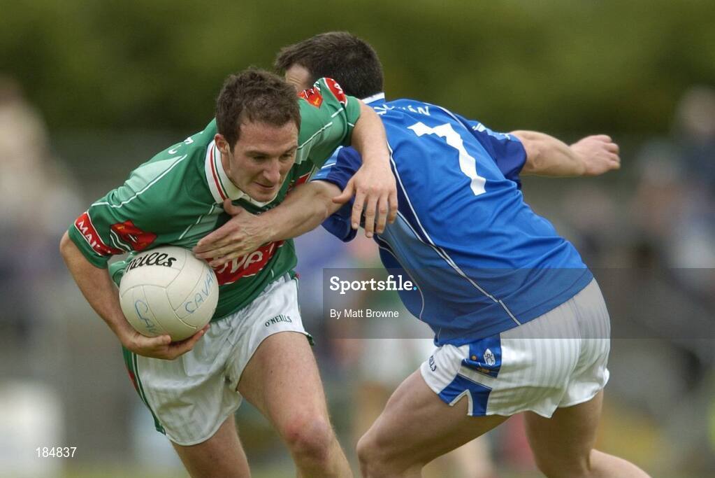 30 July 2005; Alan Dillon, Mayo, is tackled by Peter Reilly, Cavan. Bank of Ireland Football Championship qualifer, Round 4. Mayo v Cavan, Dr. Hyde Park, Roscommon. Picture credit; Matt Browne / SPORTSFILE