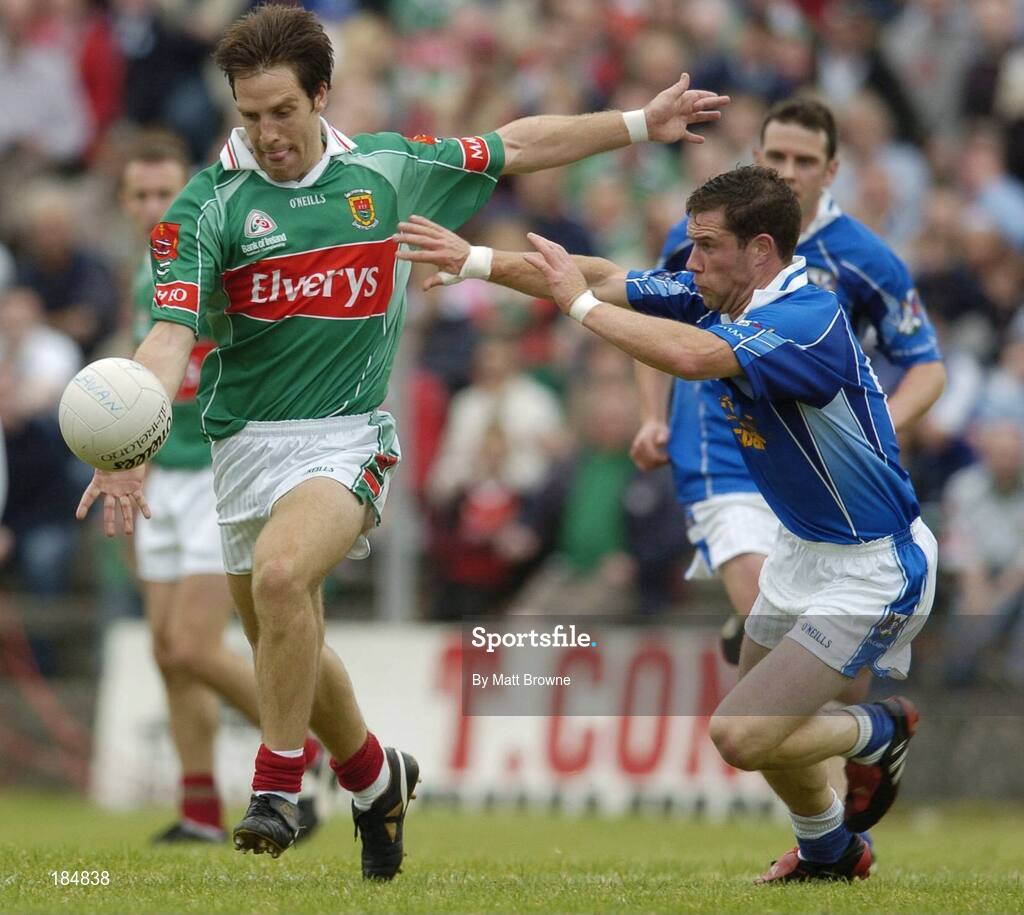 30 July 2005; Billy Joe Padden of Mayo is tackled by Finbar O'Reilly of Cavan during the GAA All-Ireland Football Championship Qualifer, Round 4 match between Mayo and Cavan at Dr Hyde Park in Roscommon. Photo by Matt Browne/Sportsfile