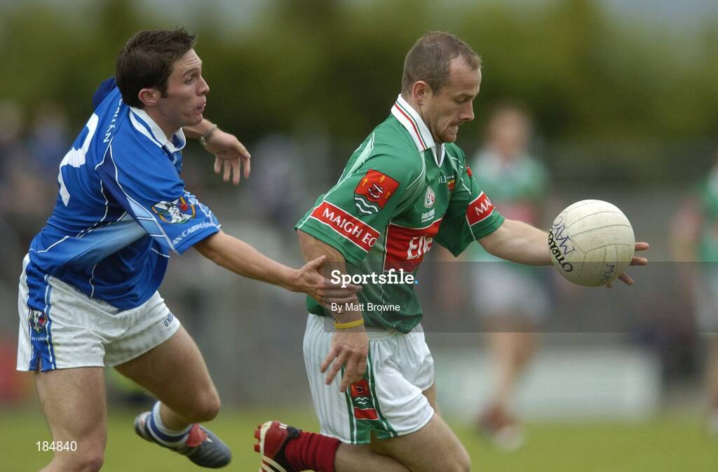 30 July 2005; Marty McNicholas, Mayo, is tackled by Michael Hannon, Cavan. Bank of Ireland Football Championship qualifer, Round 4. Mayo v Cavan, Dr. Hyde Park, Roscommon. Picture credit; Matt Browne / SPORTSFILE