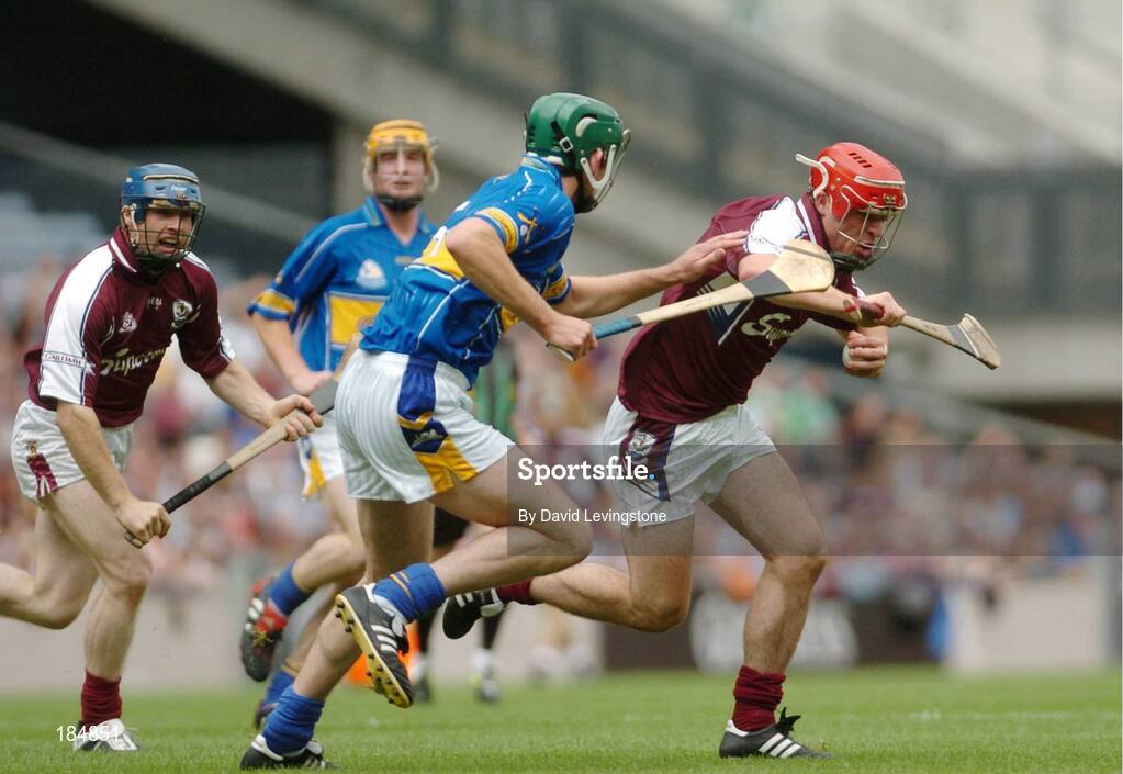 31 July 2005; Alan Kerins, Galway supported by team-mate Damien Hayes is tackled by Declan Fanning, Tipperary. Guinness All-Ireland Hurling Championship, Quarter-Final, Galway v Tipperary, Croke Park, Dublin. Picture credit; David Levingstone / SPORTSFILE