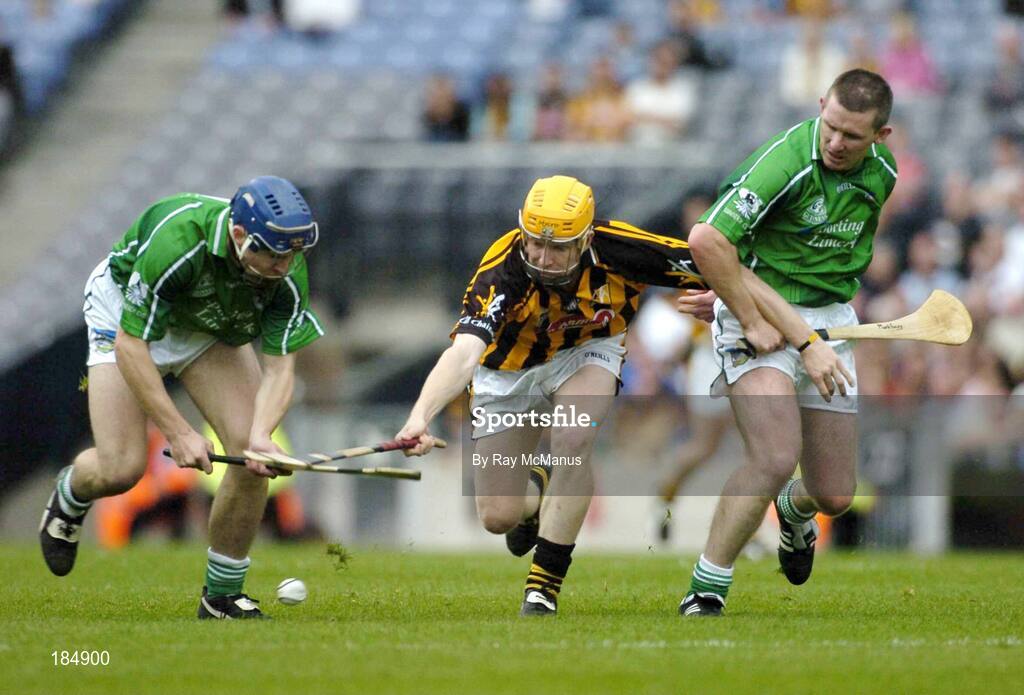 31 July 2005; Richie Power, Kilkenny, is tackled by Stephen Lucey, left, and Mark Foley, Limerick. Guinness All-Ireland Senior Hurling Championship Quarter-Final, Kilkenny v Limerick, Croke Park, Dublin. Picture credit; Ray McManus / SPORTSFILE