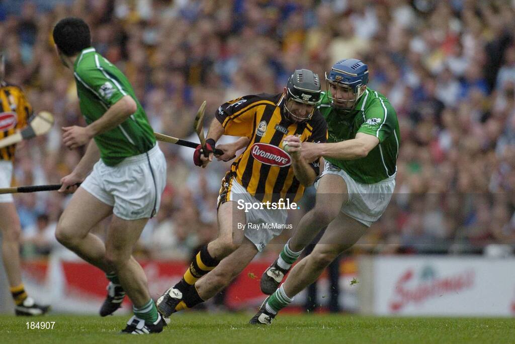 31 July 2005; DJ Carey, Kilkenny, is tackled by Stephen Lucey, Limerick. The referee gave a free against DJ Carey for over carrying the sliothar. Guinness All-Ireland Senior Hurling Championship Quarter-Final, Kilkenny v Limerick, Croke Park, Dublin. Picture credit; Ray McManus / SPORTSFILE