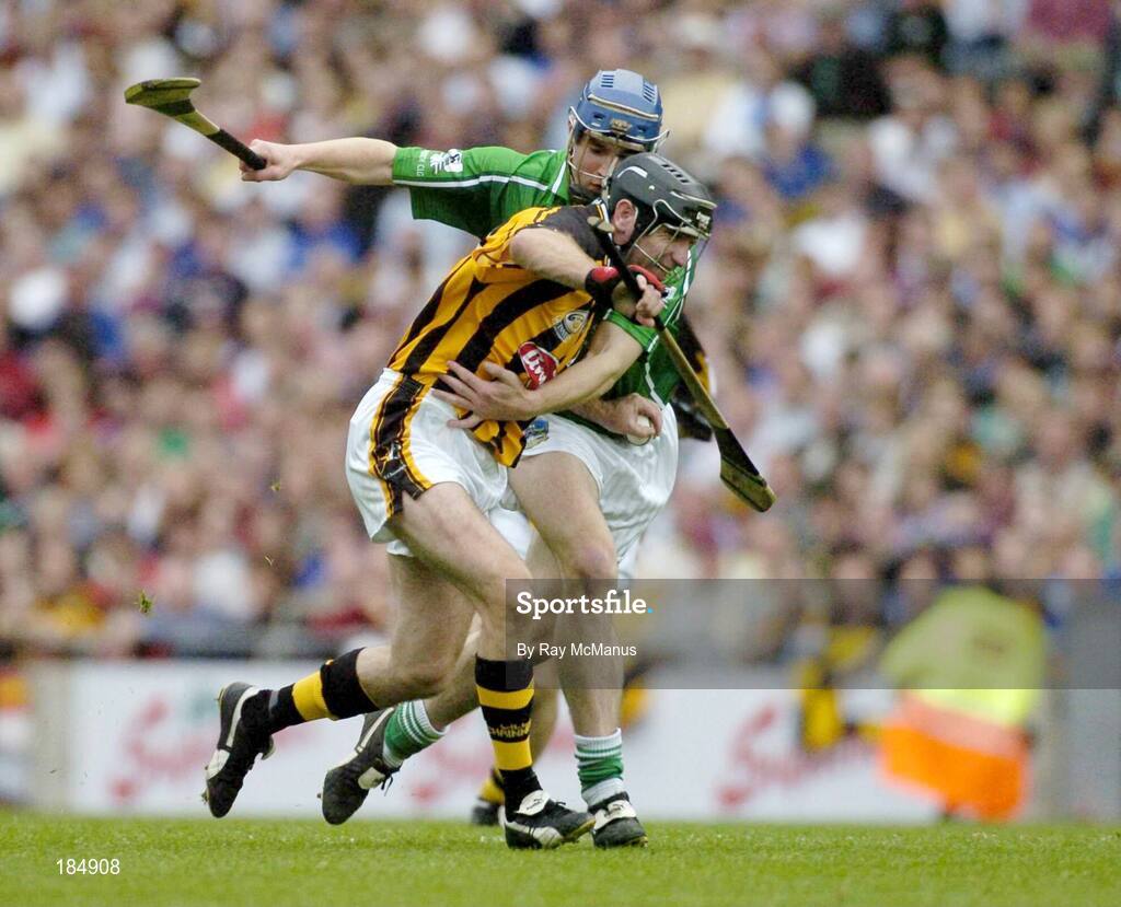 31 July 2005; DJ Carey, Kilkenny, is tackled by Stephen Lucey, Limerick. THe referee gave a free against DJ Carey for over carrying the sliothar. Guinness All-Ireland Senior Hurling Championship Quarter-Final, Kilkenny v Limerick, Croke Park, Dublin. Picture credit; Ray McManus / SPORTSFILE