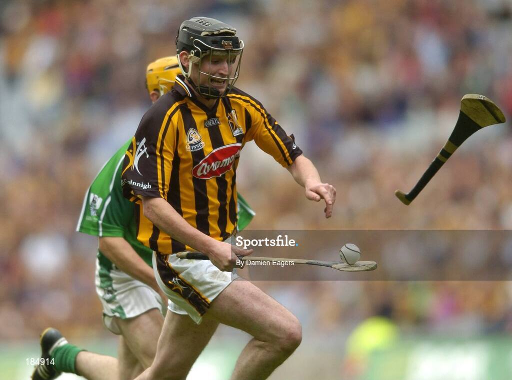 31 July 2005; Martin Comerford, Kilkenny solos through as Limerick's Paul O'Grady throws his hurley at him. Guinness All-Ireland Hurling Championship, Quarter-Final, Kilkenny v Limerick, Croke Park, Dublin. Picture credit; Damien Eagers / SPORTSFILE