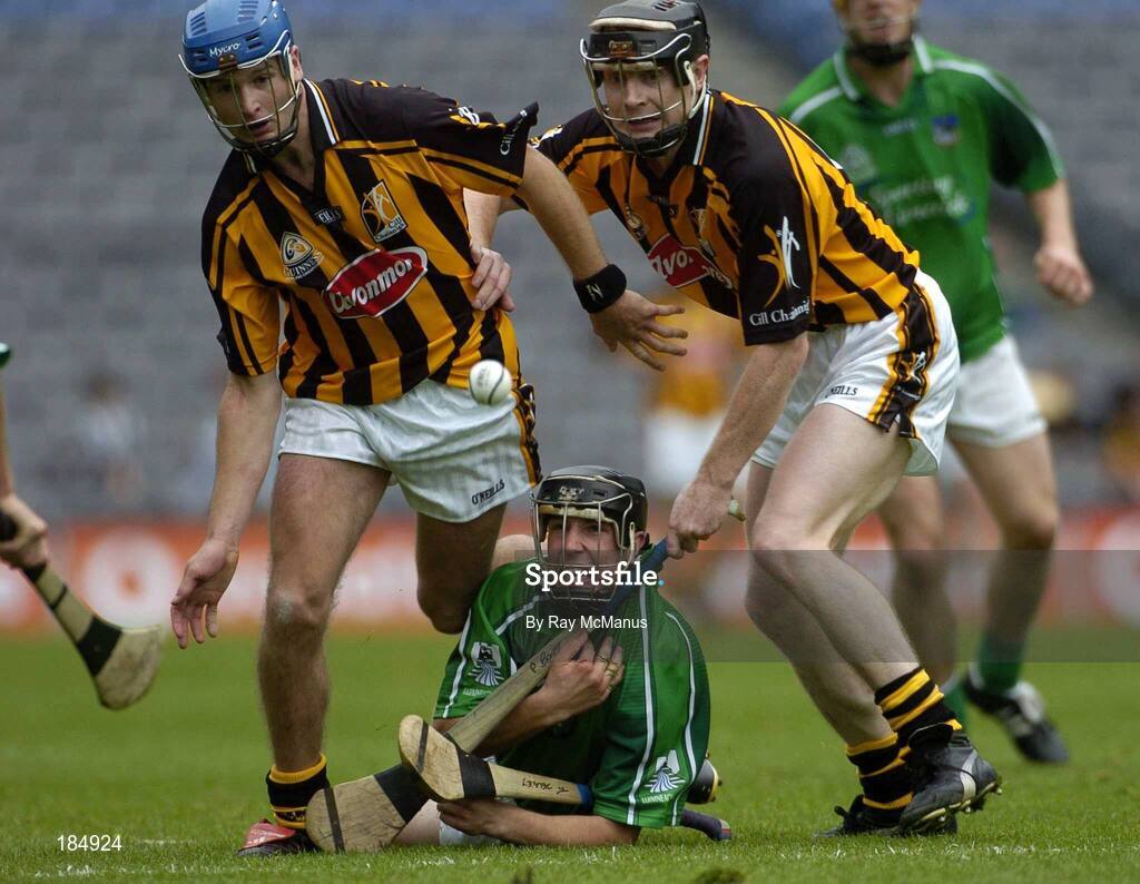 31 July 2005; Alan O'Connor, Limerick, is tackled by JJ Delaney and Peter Barry, Kilkenny. Guinness All-Ireland Senior Hurling Championship Quarter-Final, Kilkenny v Limerick, Croke Park, Dublin. Picture credit; Ray McManus / SPORTSFILE