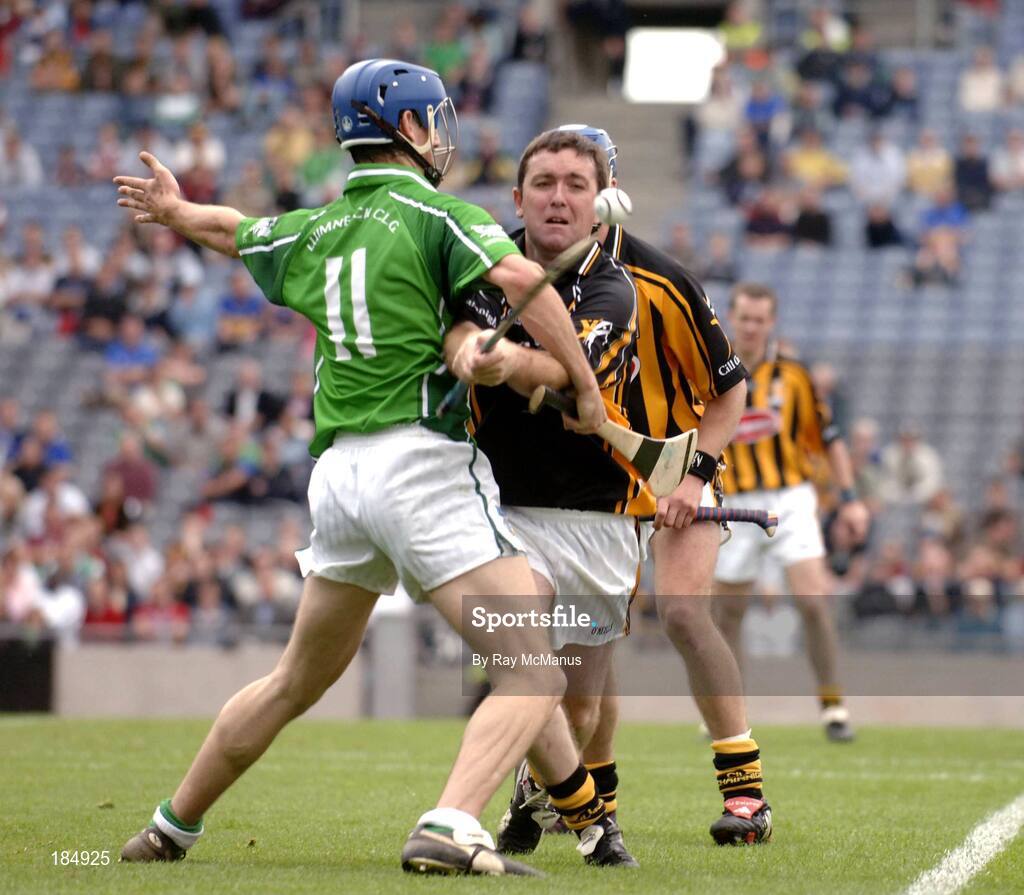 31 July 2005; James McGarry, Kilkenny, clears under pressure from James O'Brien, Limerick. Guinness All-Ireland Senior Hurling Championship Quarter-Final, Kilkenny v Limerick, Croke Park, Dublin. Picture credit; Ray McManus / SPORTSFILE