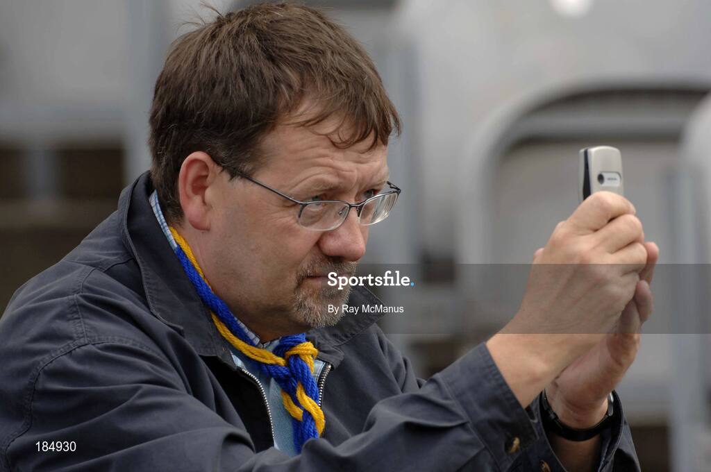 31 July 2005; Eamonn Long, from Bansha, Co. Tipperary, takes a picture on his phone. Guinness All-Ireland Senior Hurling Championship Quarter-Final, Galway v Tipperary, Croke Park, Dublin. Picture credit; Ray McManus / SPORTSFILE