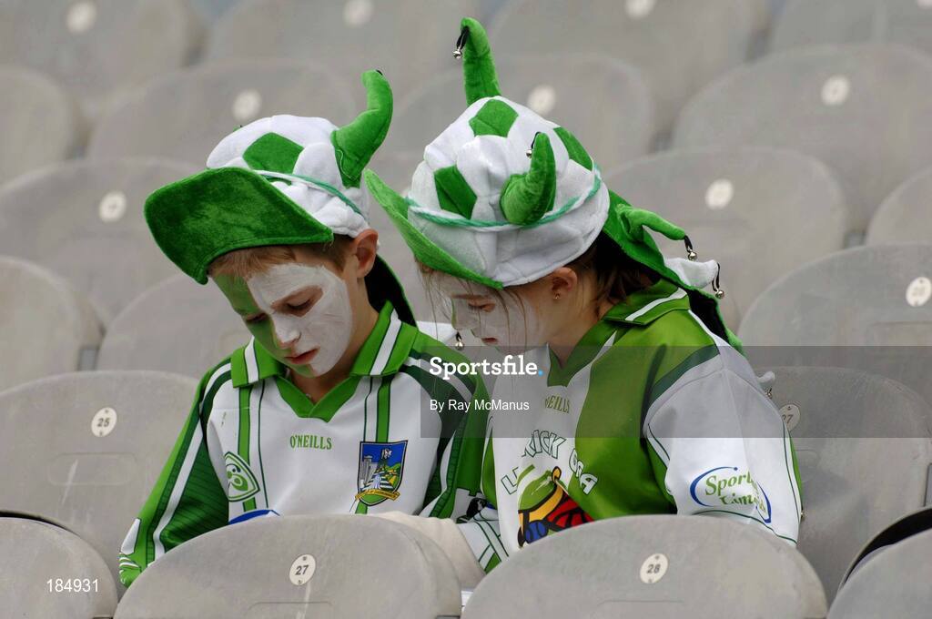 31 July 2005; Cousins Shane Lyons, 8 years, and Laura Lyons, 10 years, from the Staker Wallace club, in Kilmallock, Co. Limerick, read their programme. Guinness All-Ireland Senior Hurling Championship Quarter-Final, Kilkenny v Limerick, Croke Park, Dublin. Picture credit; Ray McManus / SPORTSFILE