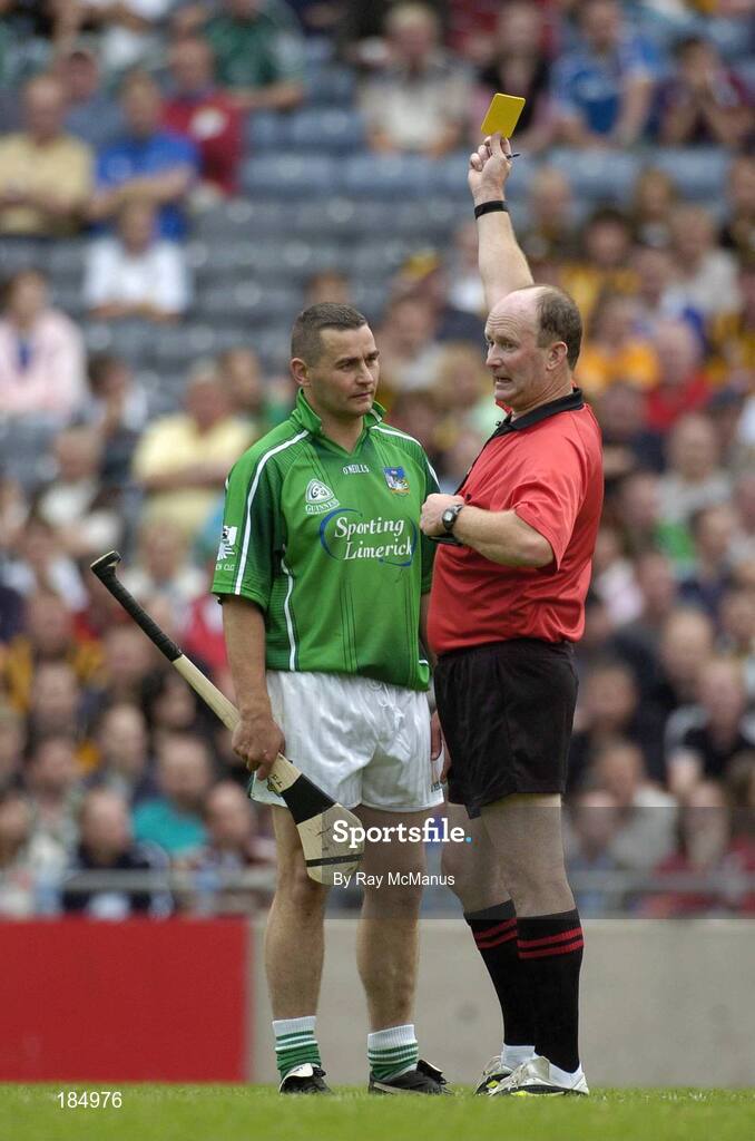 31 July 2005; TJ Ryan, Limerick, is shown the yellow card by referee Ger Harrington. Guinness All-Ireland Senior Hurling Championship Quarter-Final, Kilkenny v Limerick, Croke Park, Dublin. Picture credit; Ray McManus / SPORTSFILE