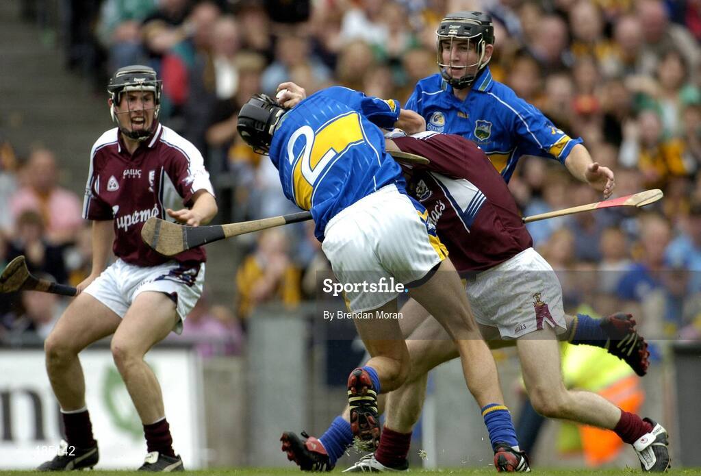 31 July 2005; Damien Hayes, Galway, holds off the challenge of Hugh Moloney (2), Tipperary, on his way to scoring his sides second goal. Guinness All Ireland Hurling Championship, Quarter Final, Galway v Tipperary, Croke Park, Dublin. Picture credit; Brendan Moran / SPORTSFILE