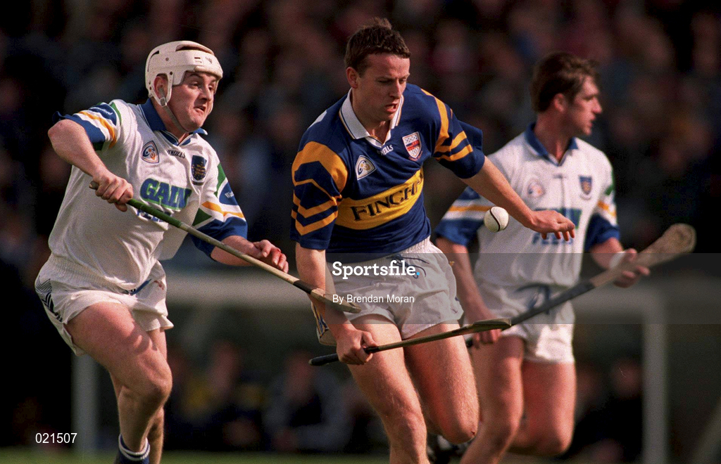 18 April 1999; Brian O'Meara of Tipperary in action against Fergal Hartley of Waterford during the Church and General National Hurling League Division 1B match between Tipperary and Waterford at Semple Stadium in Thurles, Tipperary. Photo by Brendan Moran/Sportsfile