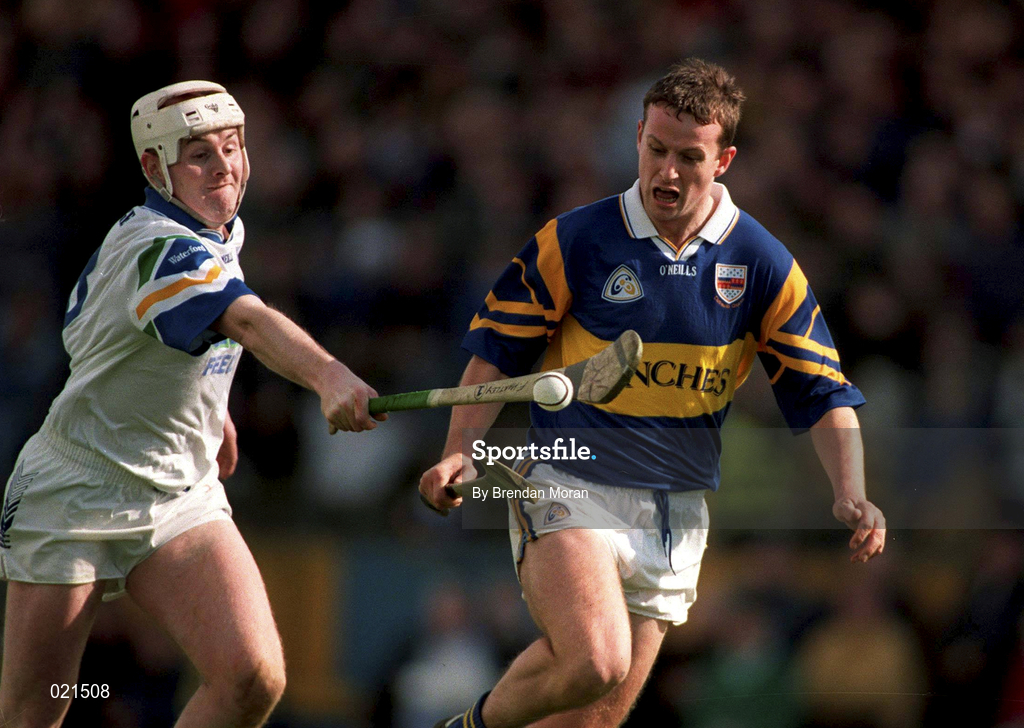 18 April 1999; Brian O'Meara of Tipperary in action against Fergal Hartley of Waterford during the Church and General National Hurling League Division 1B match between Tipperary and Waterford at Semple Stadium in Thurles, Tipperary. Photo by Brendan Moran/Sportsfile