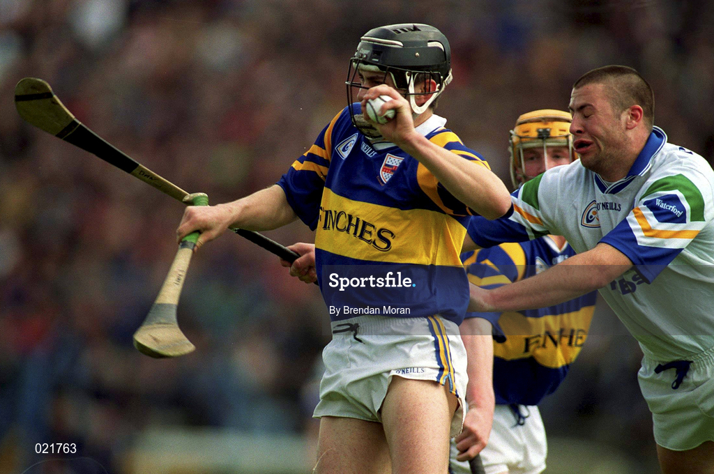 18 April 1999; Fergal Heaney of Tipperary in action against Peter Queally of Waterford during the Church and General National Hurling League Division 1B match between Tipperary and Waterford at Semple Stadium in Thurles, Tipperary. Photo by Brendan Moran/Sportsfile