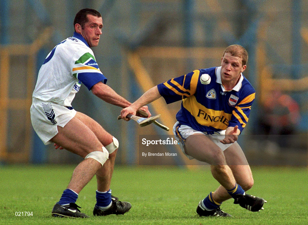 18 April 1999; Ger Maguire of Tipperary in action against Peter Queally of Waterford during the Church and General National Hurling League Division 1B match between Tipperary and Waterford at Semple Stadium in Thurles, Tipperary. Photo by Brendan Moran/Sportsfile