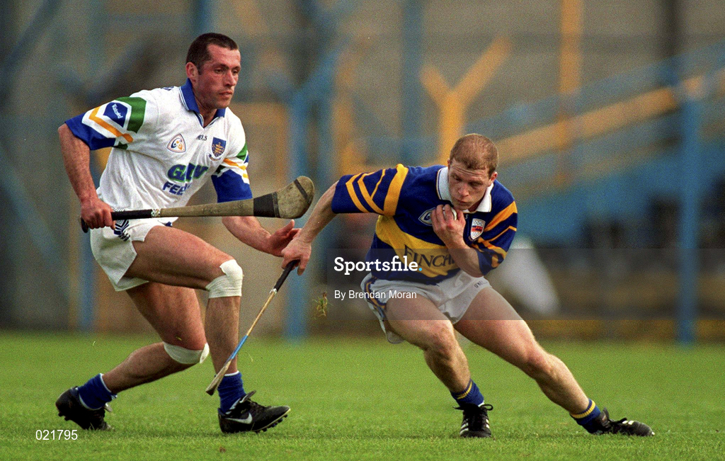18 April 1999; Ger Maguire of Tipperary in action against Peter Queally of Waterford during the Church and General National Hurling League Division 1B match between Tipperary and Waterford at Semple Stadium in Thurles, Tipperary. Photo by Brendan Moran/Sportsfile