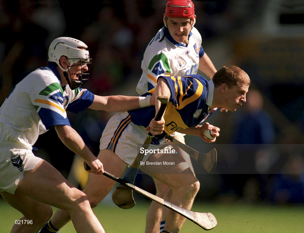 18 April 1999; Ger Maguire of Tipperary is tackled by Stephen Frampton, left, and Peter Queally of Waterford during the Church and General National Hurling League Division 1B match between Tipperary and Waterford at Semple Stadium in Thurles, Tipperary. Photo by Brendan Moran/Sportsfile
