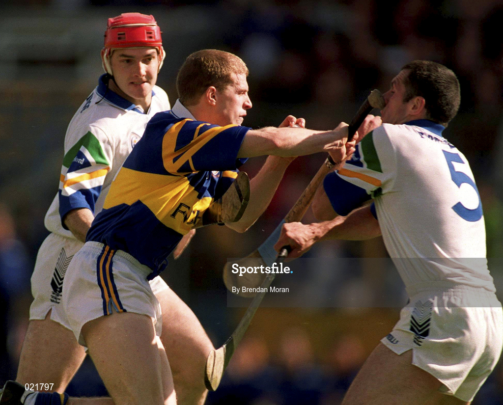 18 April 1999; Ger Maguire of Tipperary is tackled by Stephen Frampton, left, and Peter Queally of Waterford during the Church and General National Hurling League Division 1B match between Tipperary and Waterford at Semple Stadium in Thurles, Tipperary. Photo by Brendan Moran/Sportsfile