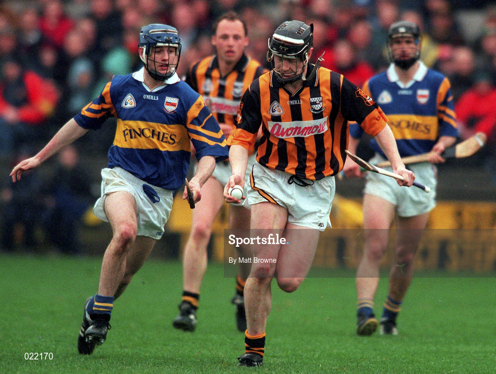 28 March 1999; Peter Barry of Kilkenny in action against Paul Kelly of Tipperary during the Church and General National Hurling League Division 1B match between Kilkenny and Tipperary at Nowlan Park in Kilkenny. Photo by Matt Browne/Sportsfile