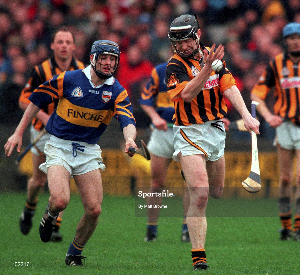28 March 1999; Peter Barry of Kilkenny in action against Paul Kelly of Tipperary during the Church and General National Hurling League Division 1B match between Kilkenny and Tipperary at Nowlan Park in Kilkenny. Photo by Matt Browne/Sportsfile