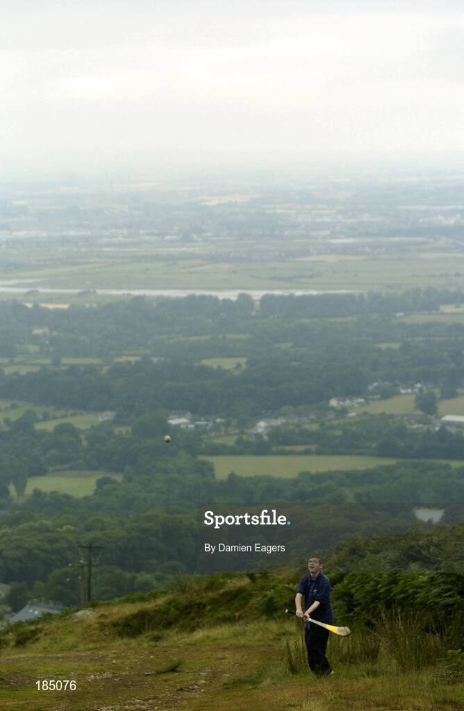 30 July 2005; A spectator plays hurling before the M Donnelly Poc Fada na hEireann Final. Annaverna Mountain Ravensdale, Cooley Mountains, Co. Louth. Picture credit; Damien Eagers / SPORTSFILE