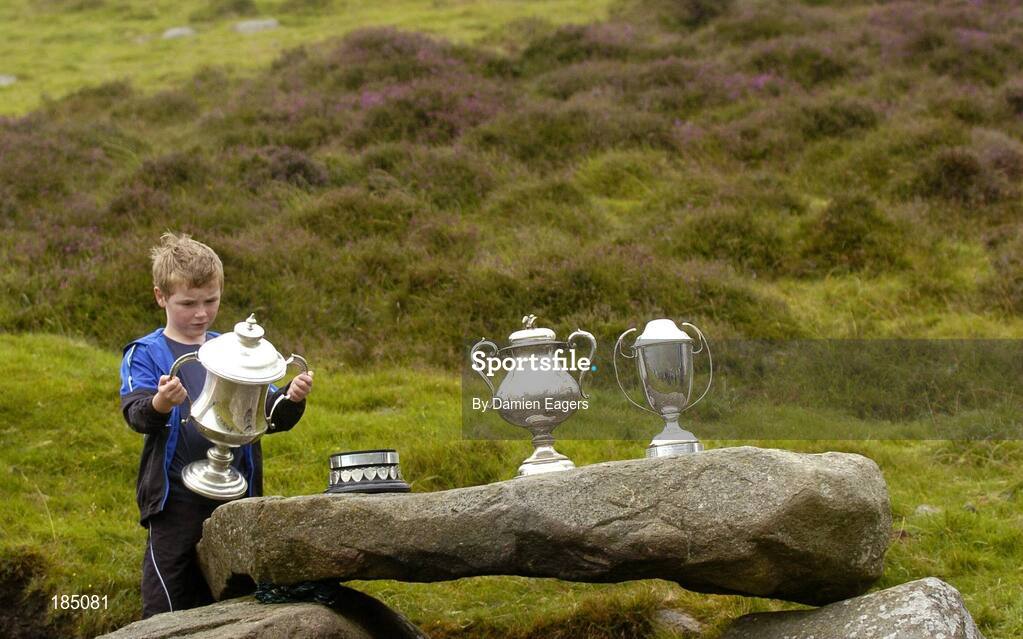 30 July 2005; A child examines the trophies before the M Donnelly Poc Fada na hEireann Final. Annaverna Mountain Ravensdale, Cooley Mountains, Co. Louth. Picture credit; Damien Eagers / SPORTSFILE