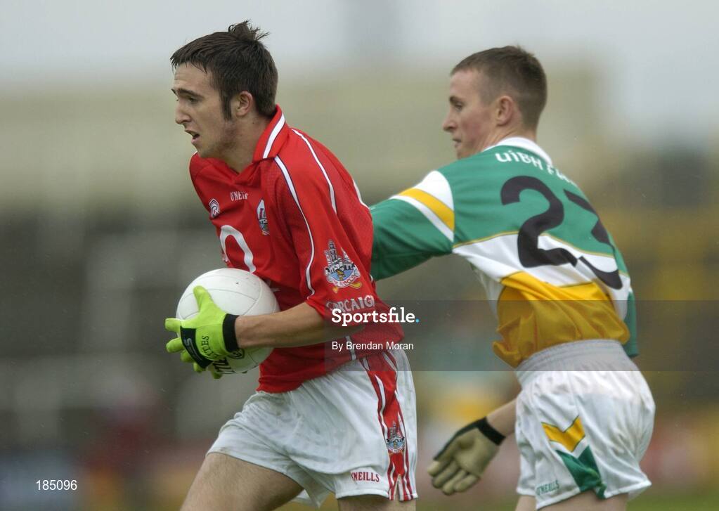 30 July 2005; Rickey Kenny, Cork is tackled by Gerry Treacy, Offaly. All-Ireland Minor Football Championship Quarter Final, Cork v Offaly, O'Moore Park, Portlaoise, Co. Laois. Picture credit; Brendan Moran / SPORTSFILE