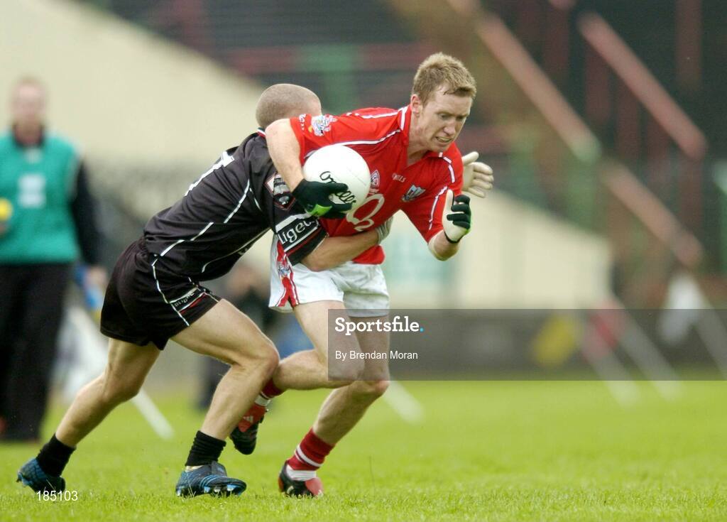 30 July 2005; Conor McCarthy, Cork, is tackled by Jonathon Davey, Sligo. Bank of Ireland Football Championship qualifiers, Round 4. Cork v Sligo, O'Moore Park, Portlaoise, Co. Laois. Picture credit; Brendan Moran / SPORTSFILE