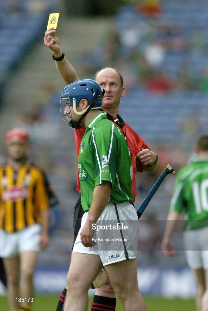 31 July 2005; Damien Reale, Limerick, is shown a yellow card by referee Ger Harrington. Guinness All-Ireland Hurling Championship, Quarter-Final, Kilkenny v Limerick, Croke Park, Dublin. Picture credit; Brendan Moran / SPORTSFILE