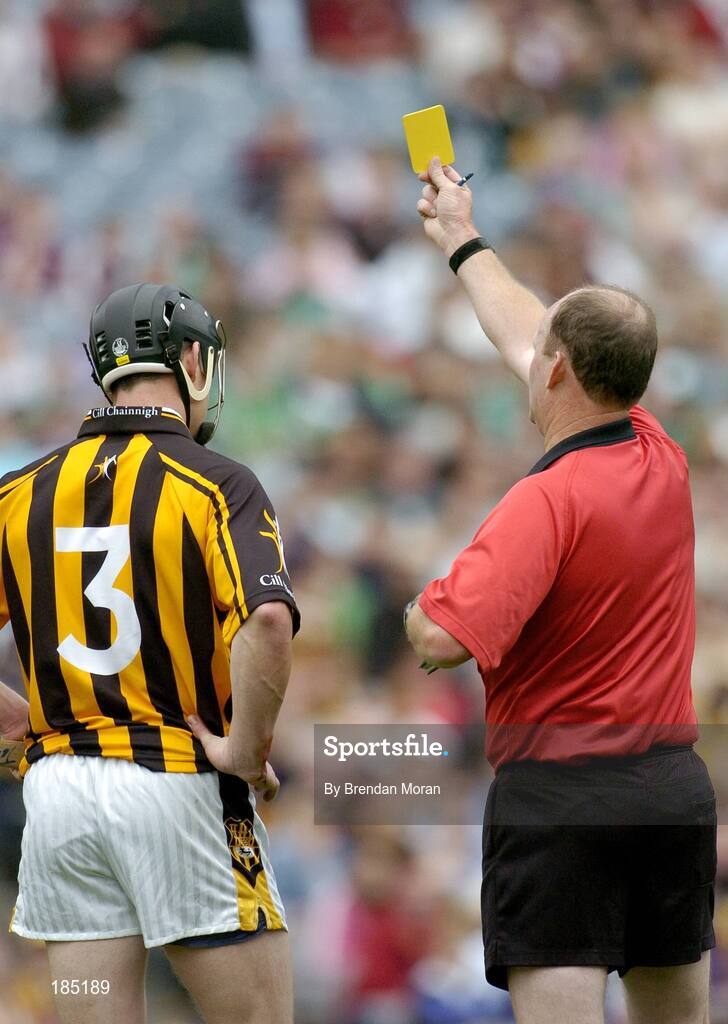 31 July 2005; Kilkenny's John Tennyson is shown a yellow card by referee Ger Harrington. Guinness All-Ireland Hurling Championship, Quarter-Final, Kilkenny v Limerick, Croke Park, Dublin. Picture credit; Brendan Moran / SPORTSFILE