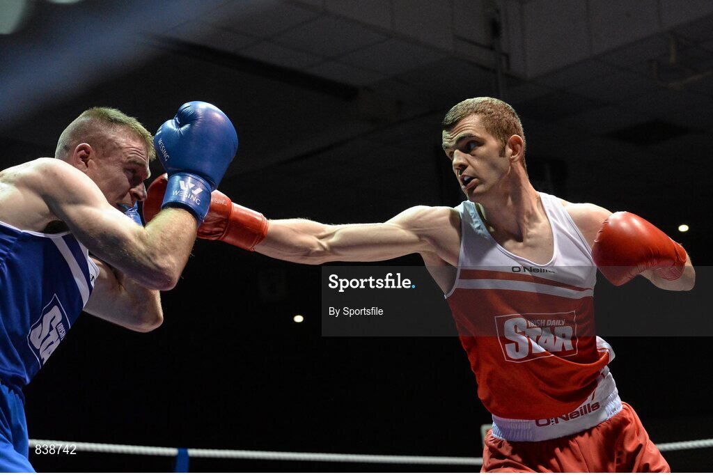1 March 2014; Adam Nolan, right, Bray Boxing Club, exchanges punches with Fergal Redmond, Arklow Boxing Club, during their 69 kg bout. National Senior Boxing Championships Semi-Finals, National Stadium, Dublin. Photo by Sportsfile