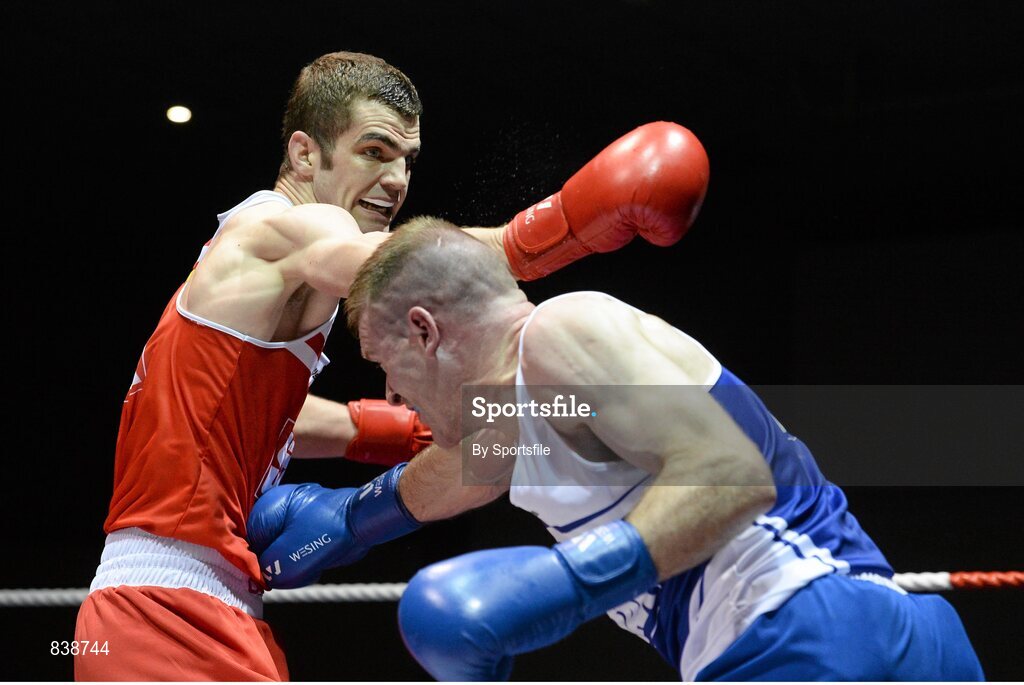 1 March 2014; Adam Nolan, left, Bray Boxing Club, exchanges punches with Fergal Redmond, Arklow Boxing Club, during their 69 kg bout. National Senior Boxing Championships Semi-Finals, National Stadium, Dublin. Photo by Sportsfile