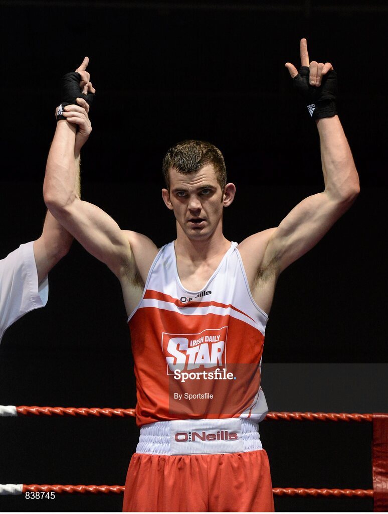 1 March 2014; Adam Nolan, Bray Boxing Club, celebrates as he is declared the winner over Fergal Redmond, Arklow Boxing Club, during their 69 kg bout. National Senior Boxing Championships Semi-Finals, National Stadium, Dublin. Photo by Sportsfile