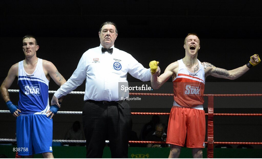 1 March 2014; Stephen Donnelly, right, All Saints Boxing Club, celebrates as he is declared the winner over John Joe Joyce, St Michael’s Athy Boxing Club, during their 69 kg bout. National Senior Boxing Championships Semi-Finals, National Stadium, Dublin. Photo by Sportsfile