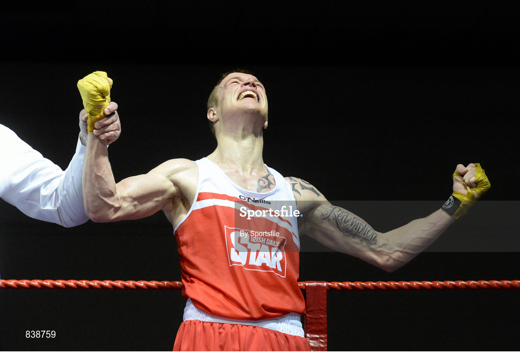 1 March 2014; Stephen Donnelly, All Saints Boxing Club, celebrates as he is declared the winner over John Joe Joyce, St Michael’s Athy Boxing Club, during their 69 kg bout. National Senior Boxing Championships Semi-Finals, National Stadium, Dublin. Photo by Sportsfile