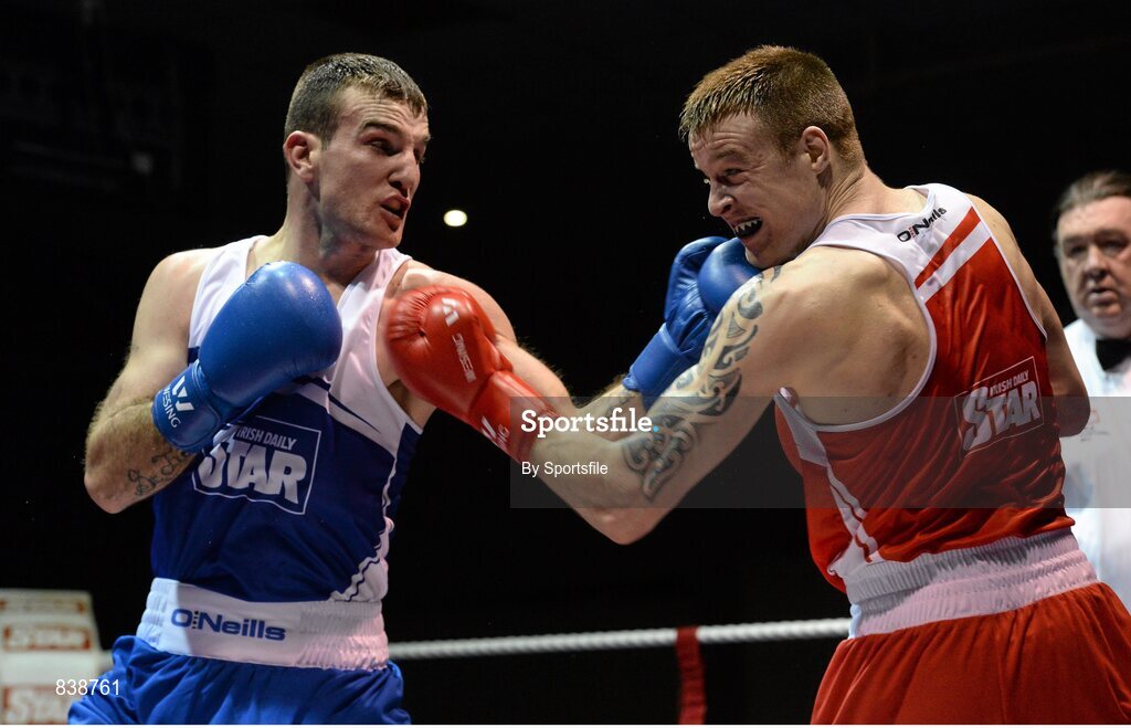 1 March 2014; Stephen Donnelly, right, All Saints Boxing Club, exchanges punches with, John Joe Joyce, St Michael’s Athy Boxing Club, during their 69 kg bout. National Senior Boxing Championships Semi-Finals, National Stadium, Dublin. Photo by Sportsfile