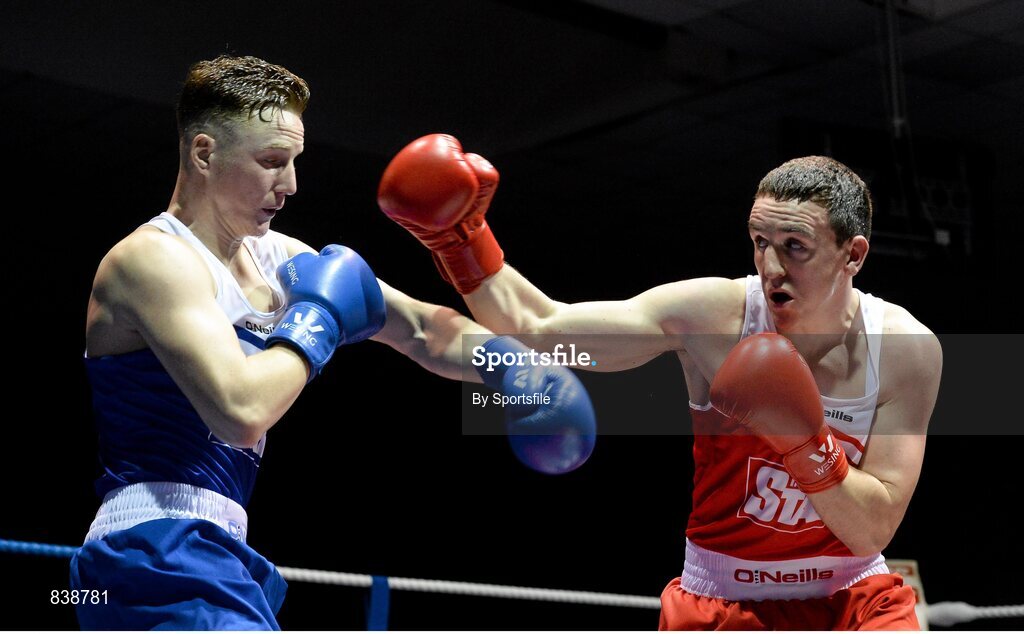 1 March 2014; Michael O'Reilly, right, Portlaoise Boxing Club, exchanges punches with, Christy Joyce, St. Michael's Athy Boxing , during their 75 kg bout. National Senior Boxing Championships Semi Finals, National Stadium, Dublin. Photo by Sportsfile