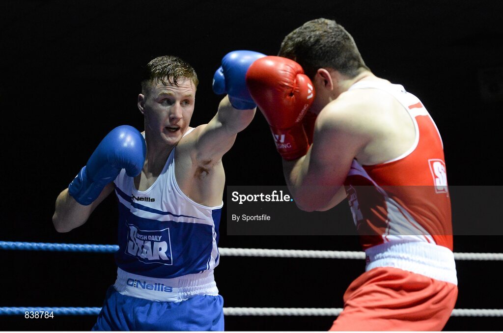 1 March 2014; Christy Joyce, left, St. Michael's Athy Boxing Club, exchanges punches with Michael O'Reilly, Portlaoise Boxing Club, during their 75 kg bout. National Senior Boxing Championships Semi Finals, National Stadium, Dublin. Photo by Sportsfile