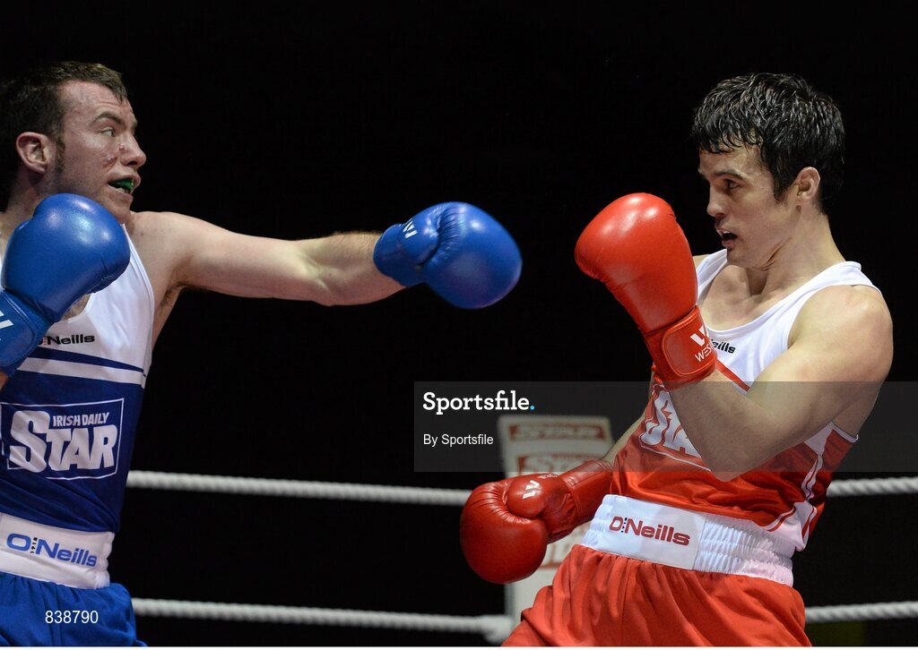 1 March 2014; Darren O'Neill, right, Paulstown Boxing Club, exchanges punches with Derek Duhig, St. Francis Boxing Club, during their 75 kg bout. National Senior Boxing Championships Semi Finals, National Stadium, Dublin. Photo by Sportsfile