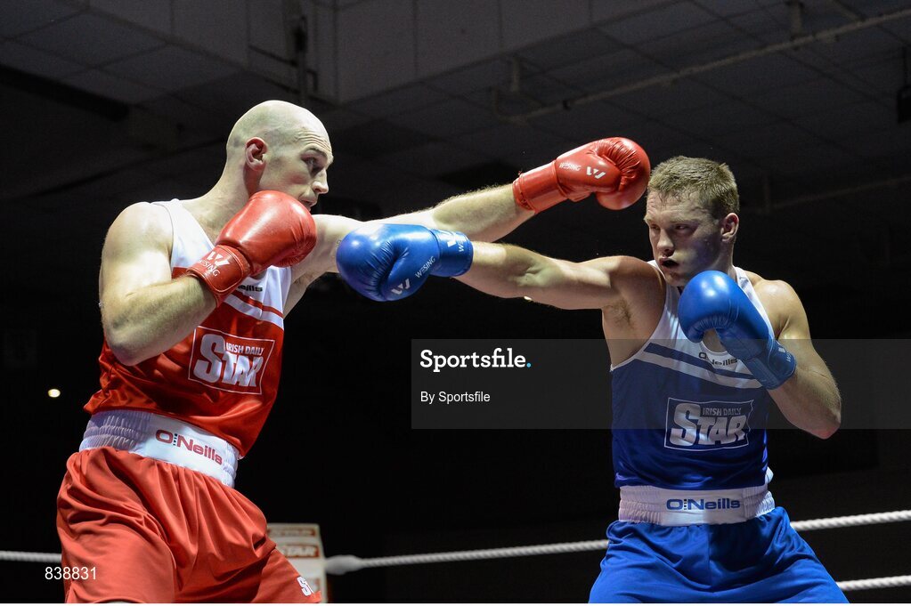 1 March 2014; Stephen Ward, left, Monkstown Boxing Club, exchanges punches with Krys Sikora, St Francis Boxing Club, during their 91 kg bout. National Senior Boxing Championships Semi Finals, National Stadium, Dublin. Photo by Sportsfile