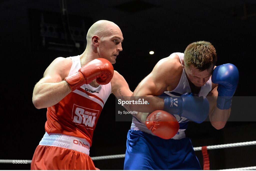 1 March 2014; Stephen Ward, left, Monkstown Boxing Club, exchanges punches with Krys Sikora, St Francis Boxing Club, during their 91 kg bout. National Senior Boxing Championships Semi Finals, National Stadium, Dublin. Photo by Sportsfile