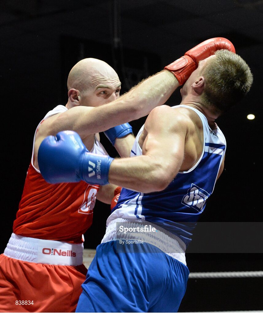 1 March 2014; Stephen Ward, left, Monkstown Boxing Club, exchanges punches with Krys Sikora, St Francis Boxing Club, during their 91 kg bout. National Senior Boxing Championships Semi Finals, National Stadium, Dublin. Photo by Sportsfile