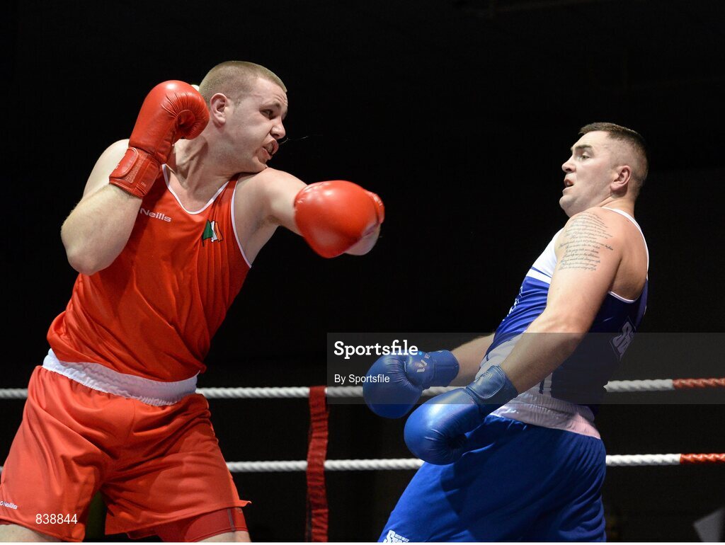 1 March 2014; Con Sheehan, left, Clonmel Boxing Club, exchanges punches with Niall Kennedy, Gorey Boxing Club, during their 91+ kg bout. National Senior Boxing Championships Semi Finals, National Stadium, Dublin. Photo by Sportsfile