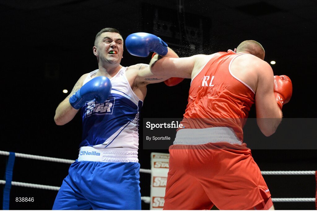 1 March 2014; Niall Kennedy, left, Gorey Boxing Club, exchanges punches with Con Sheehan, Clonmel Boxing Club, during their 91+ kg bout. National Senior Boxing Championships Semi Finals, National Stadium, Dublin. Photo by Sportsfile