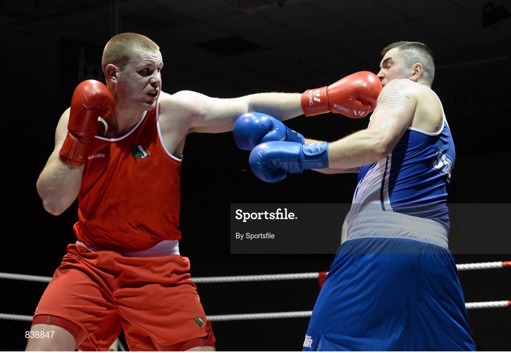1 March 2014; Con Sheehan, left, Clonmel Boxing Club, exchanges punches with Niall Kennedy, Gorey Boxing Club, during their 91+ kg bout. National Senior Boxing Championships Semi Finals, National Stadium, Dublin. Photo by Sportsfile